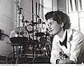 A female technician heat-testing a chemical used in explosives manufacture