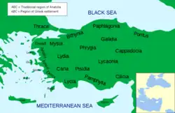 Green colored map of Asia Minor with its regions marked in black, areas settled by Greeks in italics