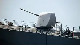 Side view of the Mk 45 main gun of Paul Hamilton