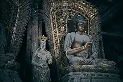 Jin dynasty (1115–1234) statue of Amoghasiddhi in Shanhua Temple in Datong, Shanxi, China, one out of a set of statues of the Five Tathagathas