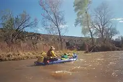 Paddler in a inflatable boat on the San Miguel River