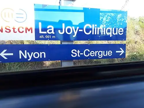 Blue red and white station with altitude and directions