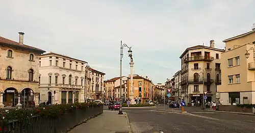 View of Piazza XX Settembre with buildings and a central column