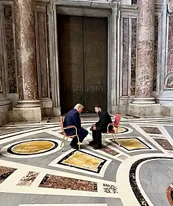 US President Donald Trump and Ukrainian President Volodymyr Zelenskyy talking inside a hall