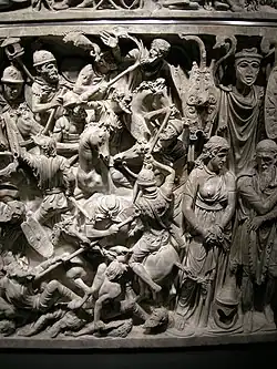 Detail of the front-right: trophies, barbarian chief with Suebian knot (people of the Quadi or Marcomanni or Buri) and presumed consort.[72]