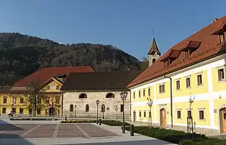 Stara Sava, the main square. From the left to the right, the Ruard Manor, Assumption of Mary Church, the Worker Barracks