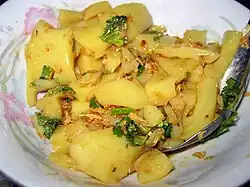 To hpu thouk - yellow tofu salad is a national favourite.